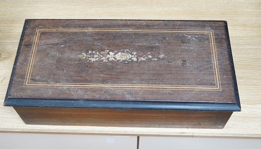 A 19th century Swiss cylinder music box, 58cm wide. Condition - fair to good, considerable wear to case